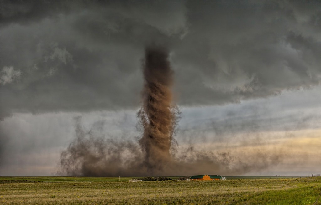 Jaw-dropping, rare anti-cyclonic tornado tracks in open farm land narrowly missing a home near Simla, Colorado.
